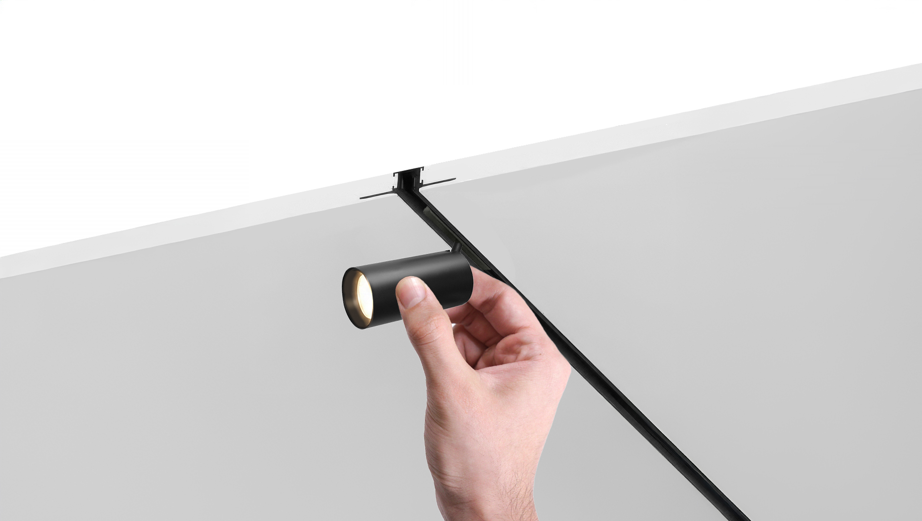 Micro Track Recessed Drywall View Teeny Track Head with hand_lightOn.jpg